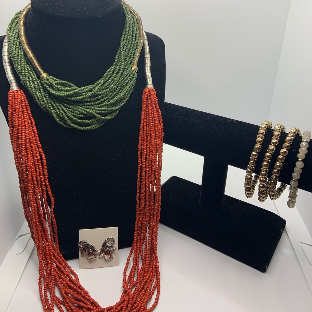 2 necklaces 4 bracelets and one pair of earrings